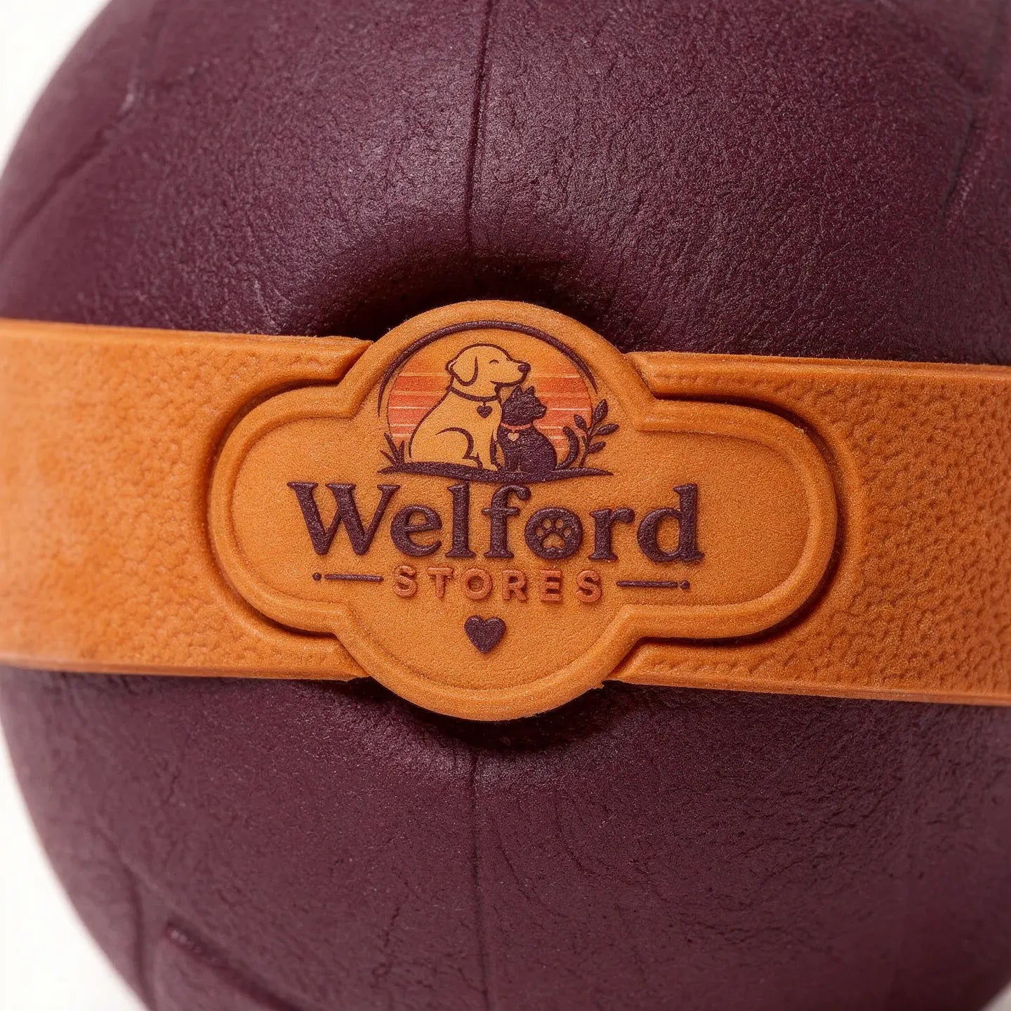 Macro detail of the crescent aperture and grip texture on the Welford Give-Way chew ball