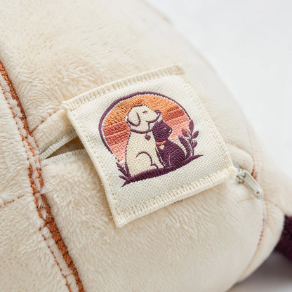 Macro detail of the woven emblem patch stitched to the Welford Vault catnip kicker